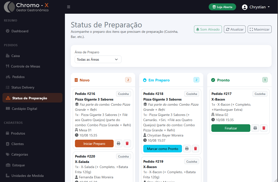 Tela de Status de Preparação do Chromo-X: o painel da cozinha, com filtro por área de preparo e os pedidos em colunas (Novo, Em Preparo, Pronto) mostrando os itens e adicionais de cada um.
